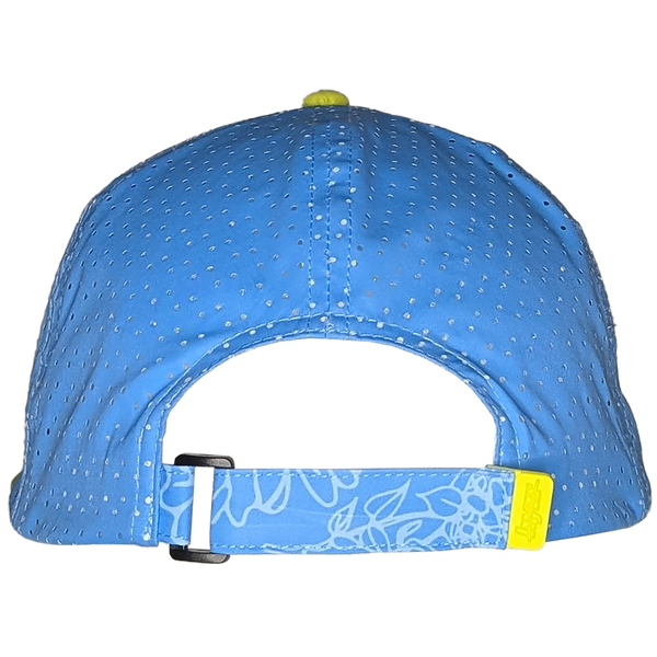 Back view of the Cordelia Deck Hat showing the adjustable velcro strap with rubber tab. Powder blue 7-panel hat, with a floral print and pops of yellow.