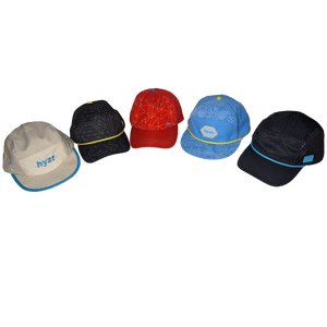 Group shot of five hats. Colors of hats (left to right) are cement, black, red, powder blue, and charcoal.