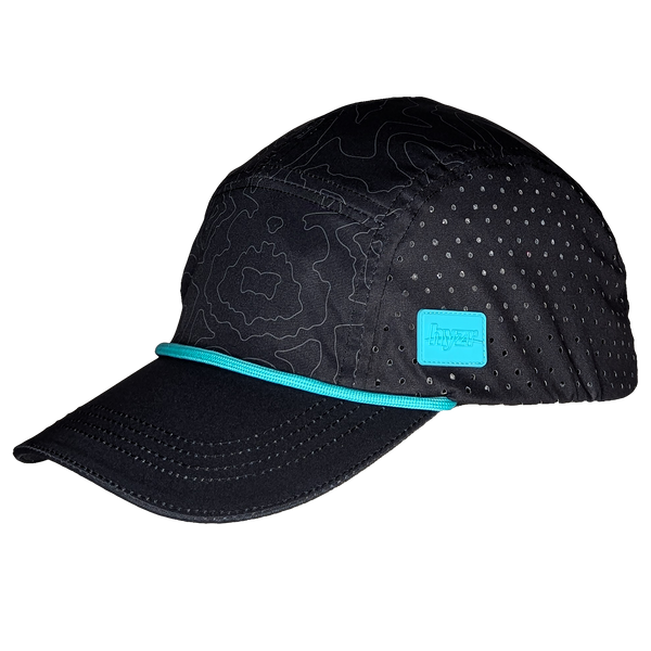 45 degree view of the Leda Stride Hat. Charcoal colored 5-panel hat, with a topographical print and mint rope and logo.