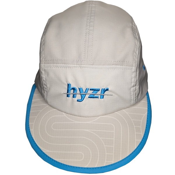 Top view of the Styx Trail Hat. Cement colored 5-panel hat, with a zen garden print and pops of electric blue.