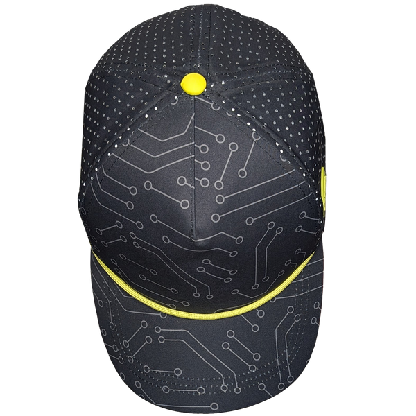 Top view of the Tethys Drive Hat. Black trucker hat, with a circuit board print and yellow accents.
